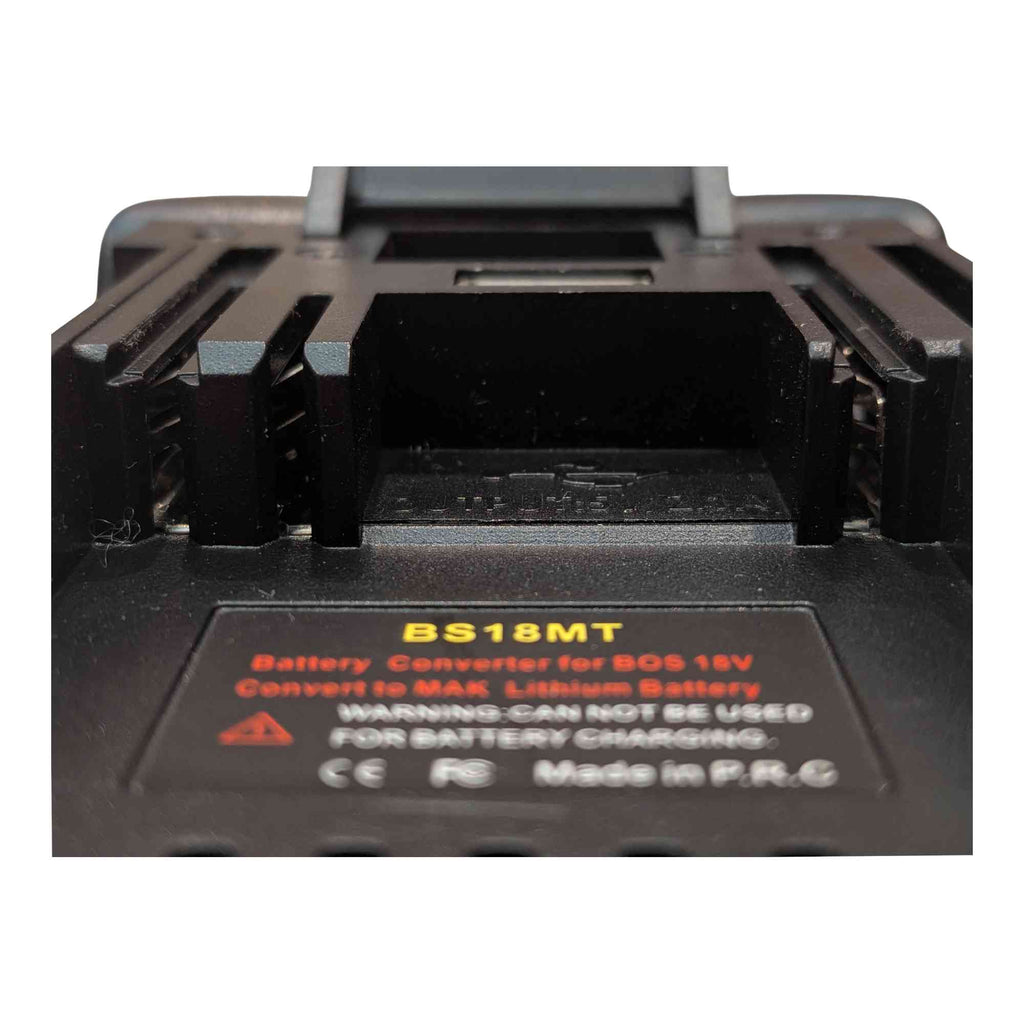Bosch 18V GBA (Blue) to Makita 18V LXT battery adapter - close-up of the Makita tool-side rail channel, printed label below