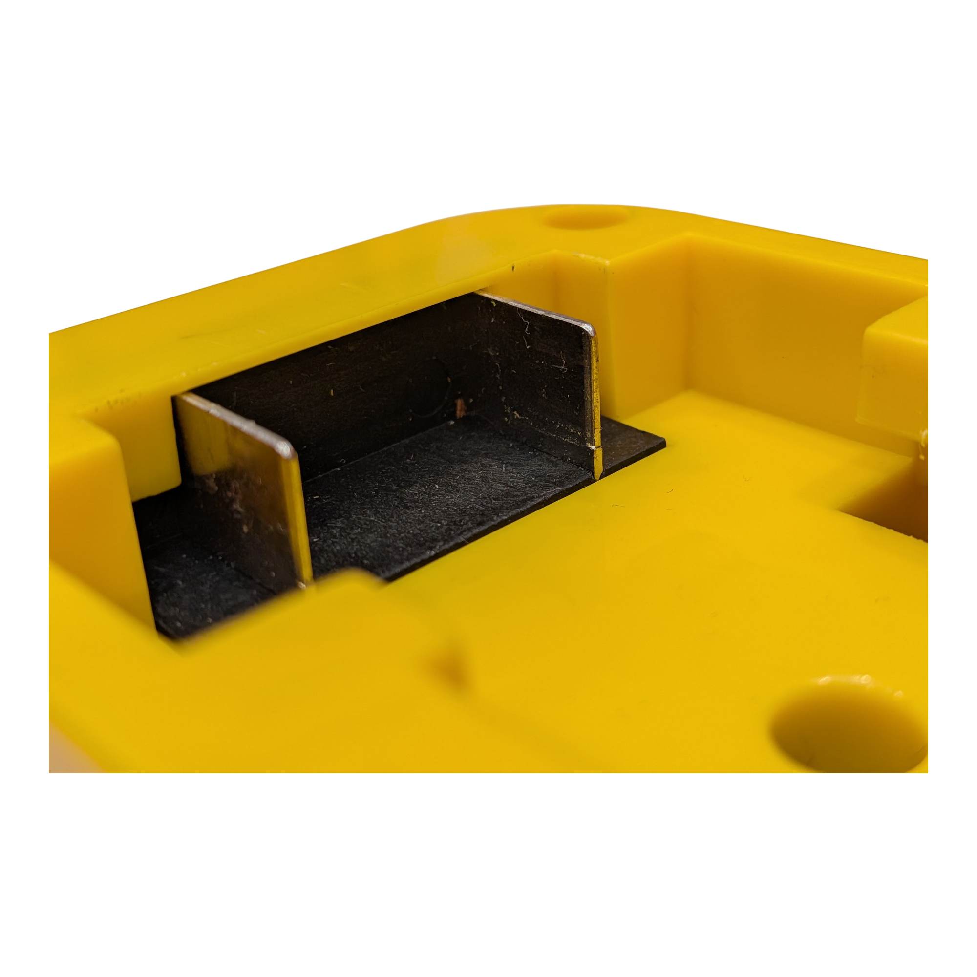 DeWalt 20V MAX to Black and Decker 20V battery adapter - close-up of a copper blade in the battery-side channel