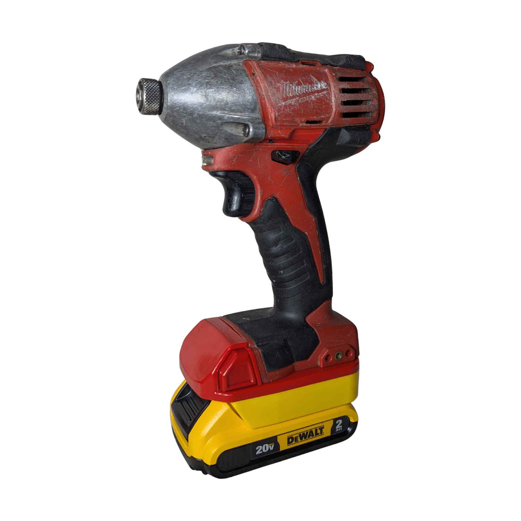 DeWalt 20V MAX to Milwaukee M18 battery adapter - installed on a Milwaukee impact driver with the DeWalt battery attached