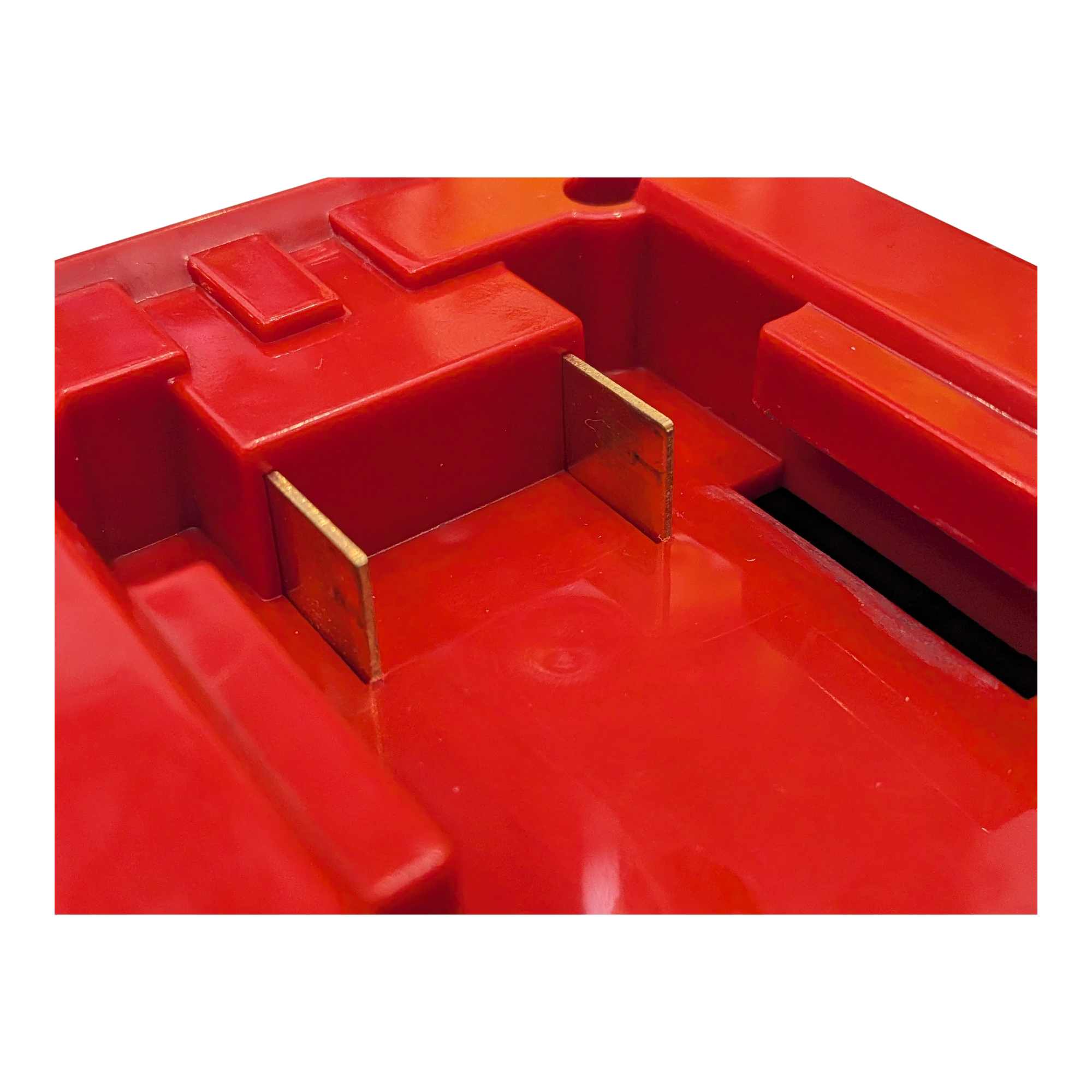 Milwaukee M18 to Black and Decker 18V Ni-Cd battery adapter - close-up of the red battery-side connection, copper blades