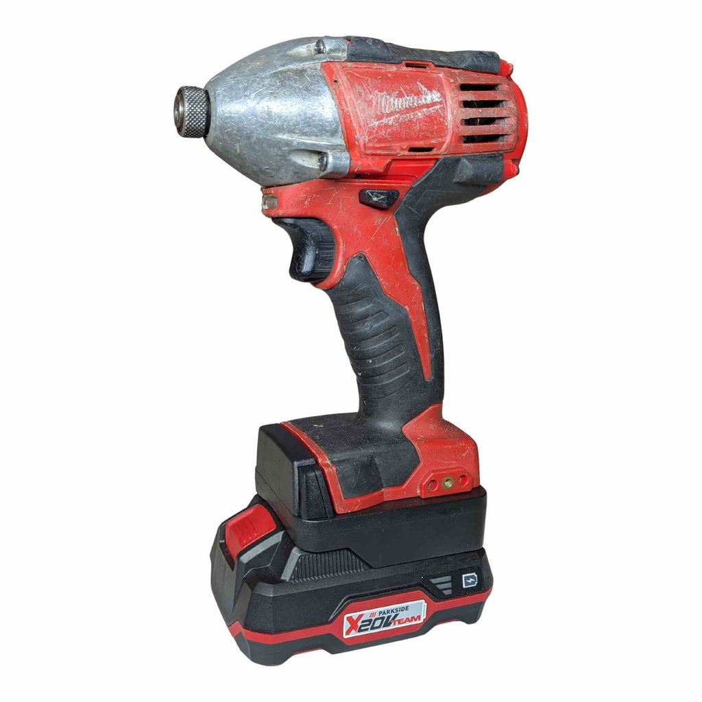 Parkside X20V to Milwaukee M18 battery adapter - installed on an impact driver with the battery pack fitted below - side view