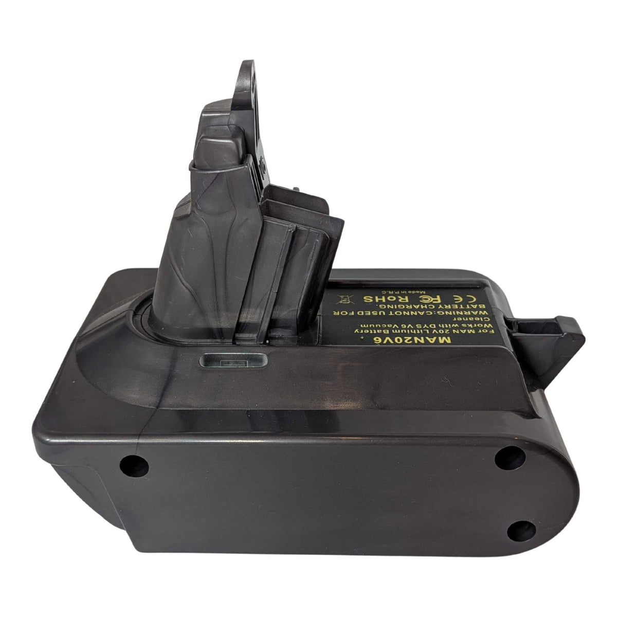 Stanley V20 to Dyson V6 battery adapter - side view with the Dyson tool-side stem upright, warning label along the top face