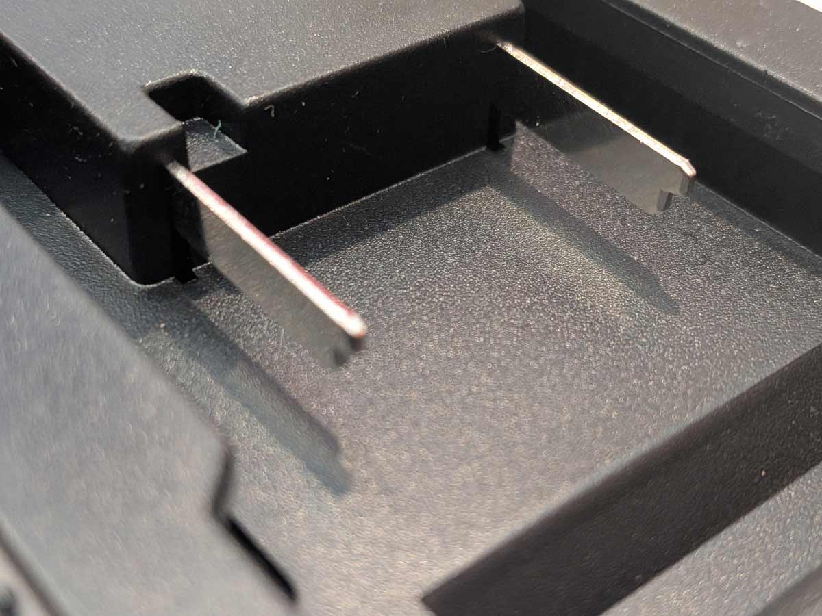 Einhell 18V PXC to Makita 18V LXT battery adapter - close-up of the twin blade terminals on the battery-side connection